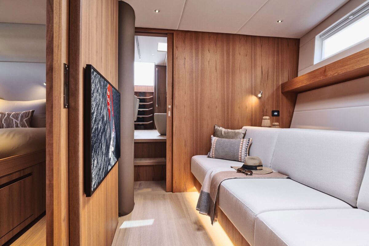 Yacht interior with beige coloured sofas and light oak wood walls